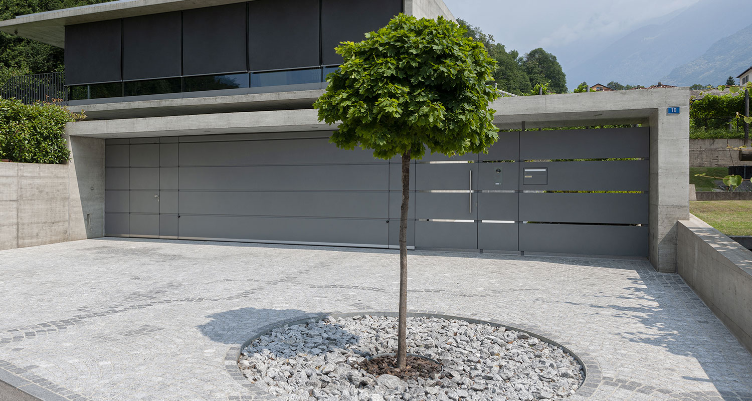 Porta garage basculante con porta pedonale Complesso